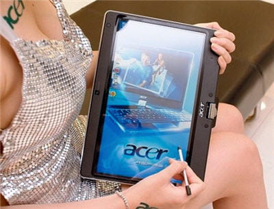 en photo, un netbook-tablette tactile d'acer (écran pivotant sur le clavier)